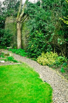 A gravel path in an English garden