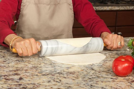 woman making pasta or flat bread