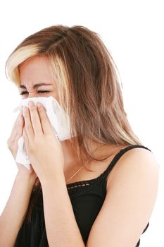 Closeup of gorgeous caucasian woman with cold sneezing into tissue over white background