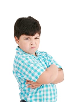 serious little boy with hands folded standing isolated on white background