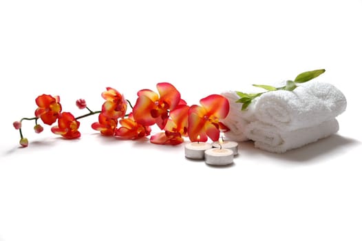 Orchid, towel, bamboo, candle in a spa