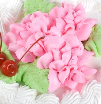 cream cake closeup with cherry on a grey