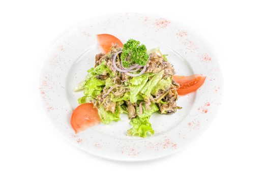 Salad of squid with roast chicken meat, apples, tomatoes, eggs and peppers