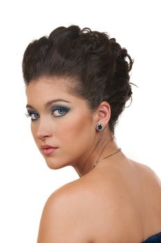 Young woman with beautiful hairstyle, make up and sapphire jewelry
