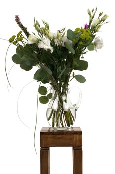 A bouquet of flowers on a small table