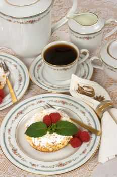 Raspberry tart with raspberry jelly filling, fresh raspberries, mint and coffee