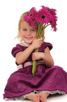 Beautiful little girl giving flowers