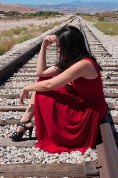 Fashion model with a designer red dress 