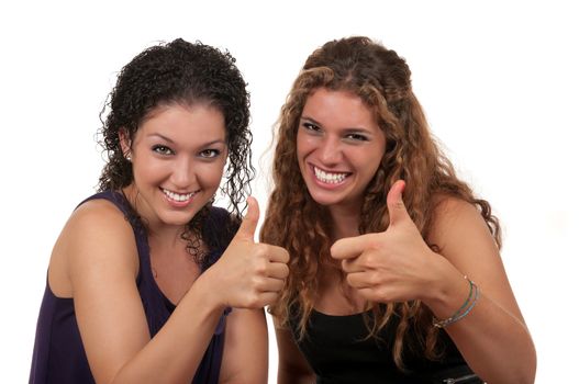 Two cute teens showing thumbs up