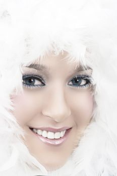 Girl with beautiful make up and white feathers