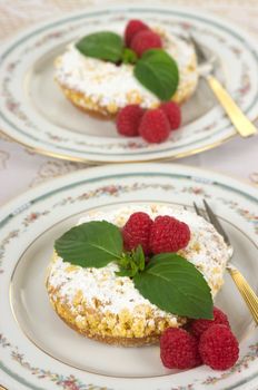 Raspberry tart with raspberry jelly filling, fresh raspberries and mint
