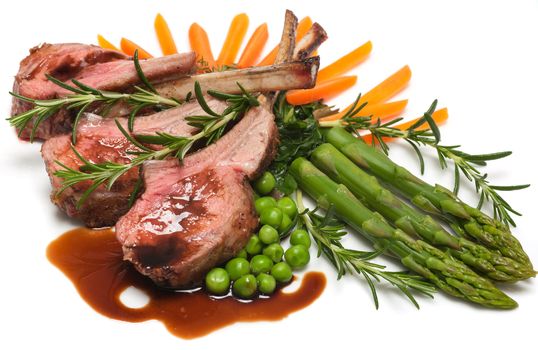 Gourmet lamb chop with vegetables, herbs and balsamic vinegar