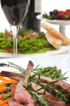 Lamb chop, salad, dessert and wine