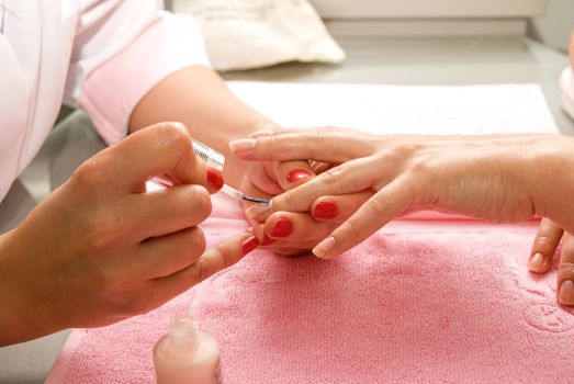 Female hands closeup at manicure process