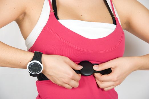 Girl with checking pulse watch closeup