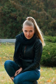 young beauty woman in autumn park portrait