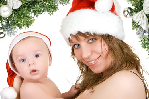 Beautiful mommy santa and her baby Santa boy on a white