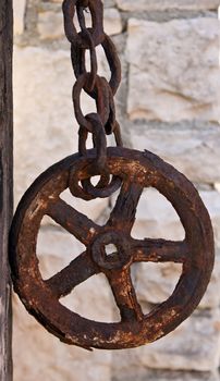 old metal rusty wheel and chain 