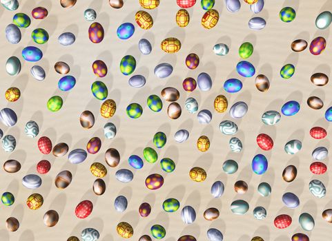 Easter eggs with different colors seen from above lying on a bed of sand at random