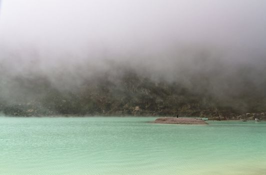 Fog forming on volcanic crater lake surface in Bandung, West Jawa