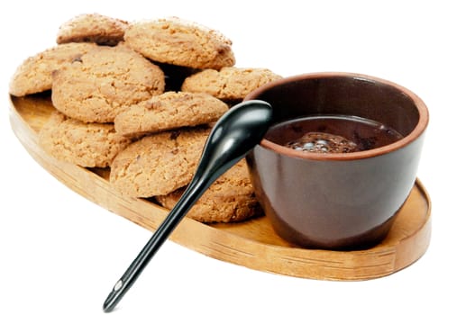 cookie and fresh cacao on wooden tray on dessert