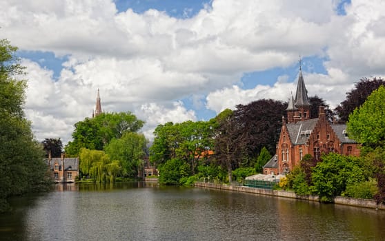 old brick house on the channel in Bruges in a sunny day. Belgium