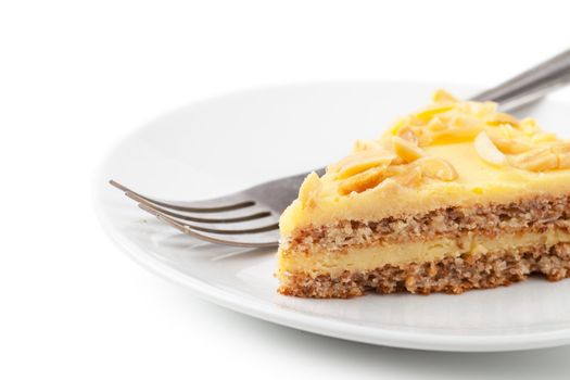 Closeup view of piece of sweet pie on a white plate