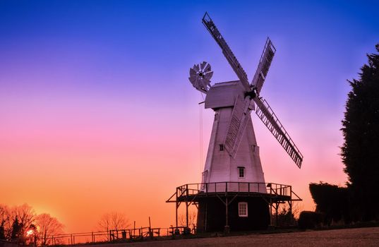 Dusk near a restored Kentish Smock Mill in Kent