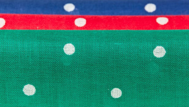 Folder linen handkerchiefs in red blue and green with white spots