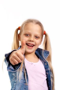 A portrait of a pretty little girl holding her thumb up