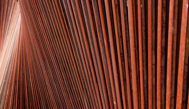 Abstract view of wall of red rusted steel beams