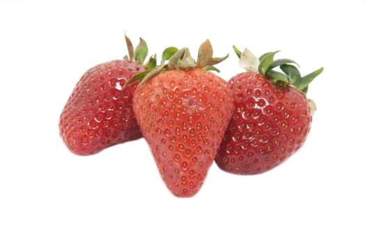 several large strawberries on a white background