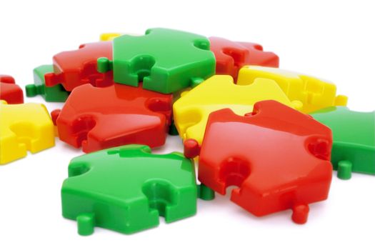 Parts of a puzzle with funny colors on a white background