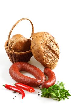 Appetizing sausage, bread and red chilly pepper on white background