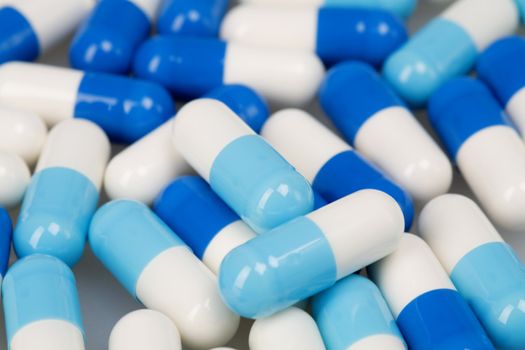 Set of white blue tablets as a background on medical subjects