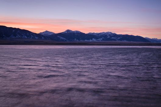 Ennis Lake and the Madison Mountain Range at sunrise on a windy morning in late winter, Madison County, Montana, USA