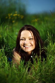  happy woman lay on green grass