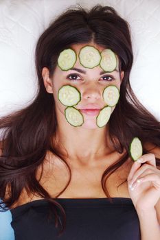 cucumbers circles on a girl face
