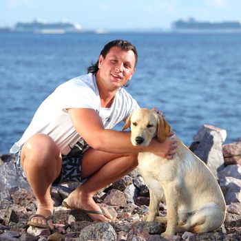 man and dog blue sky on background