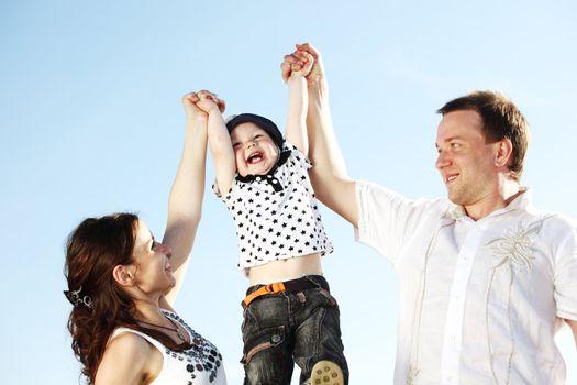 happy family blue sky on background