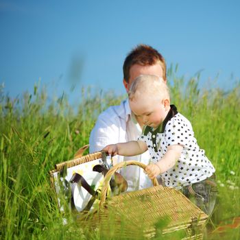  happy family on picnic in green grass