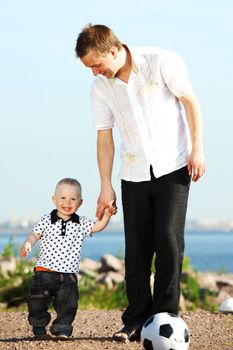 little boy play soccer outdoor