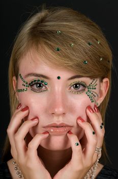 Girl with rhinestone make up. 