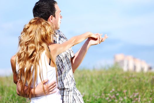 man and woman see houses and new flat