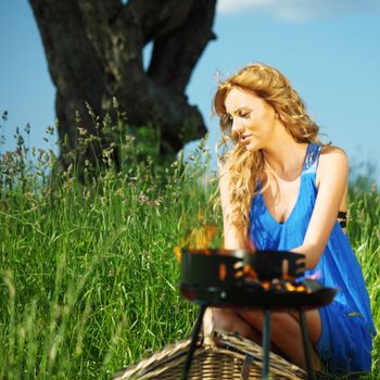 man and woman on picnic in green grass