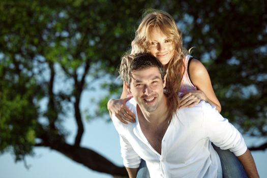 man and woman hug in the sky