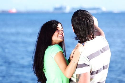 man and woman hug in the sky sea on background