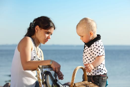 happy mother and son on picnic near sea