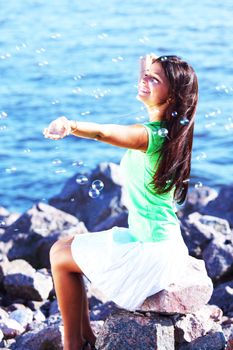 woman relax blue sea and bubbles on background