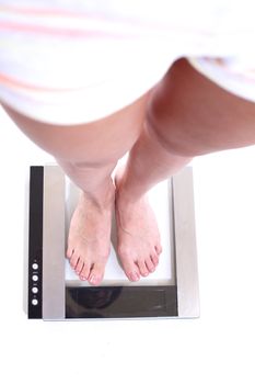 legs on scales isolated on white background